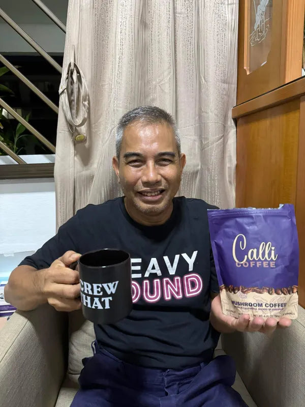 Anuar with a pouch of Calli coffee