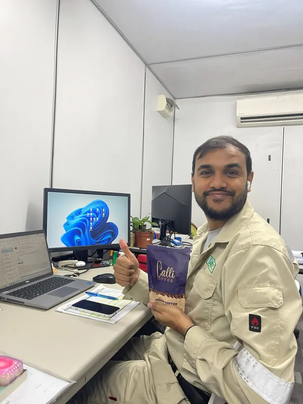 Sanjeev with a pouch of Calli coffee