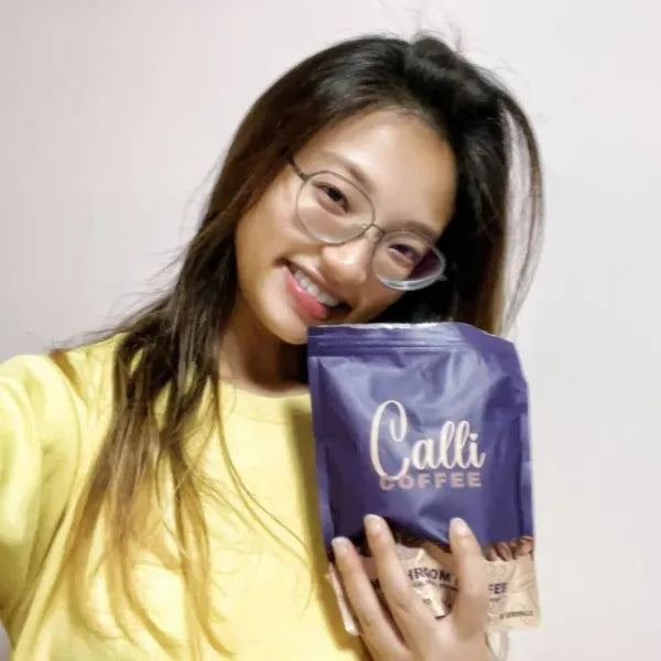 Shu Wen with a pouch of Calli coffee